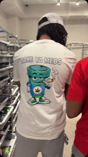 Back view of the white Take Ya Meds tee with the large mascot graphic
